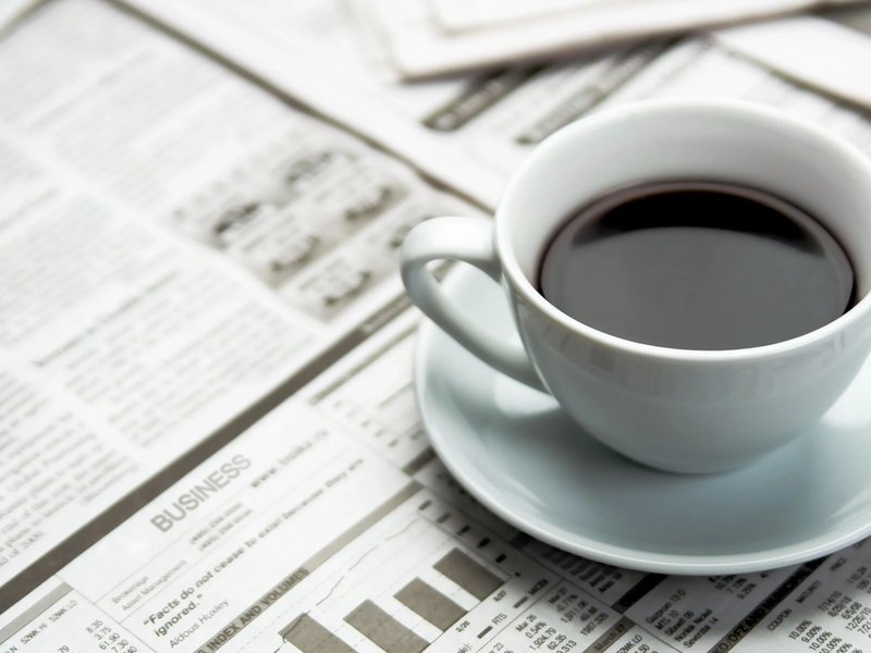 Coffee on a newspaper from Carpet Plus in the Worthington, MN area